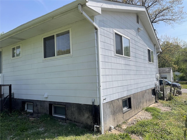 view of property exterior featuring fence