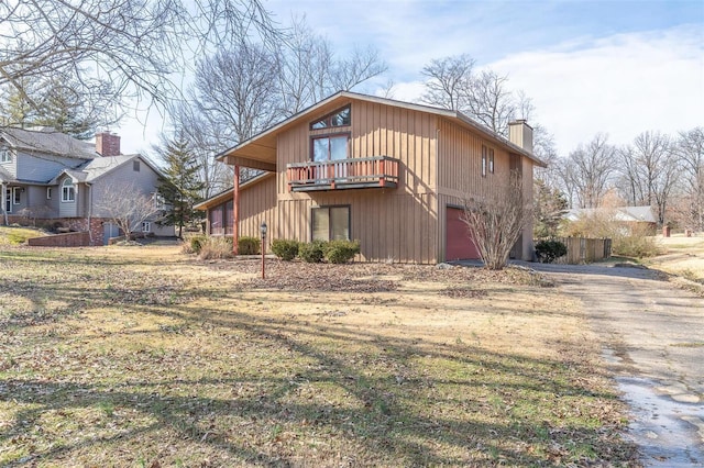 back of property with a garage