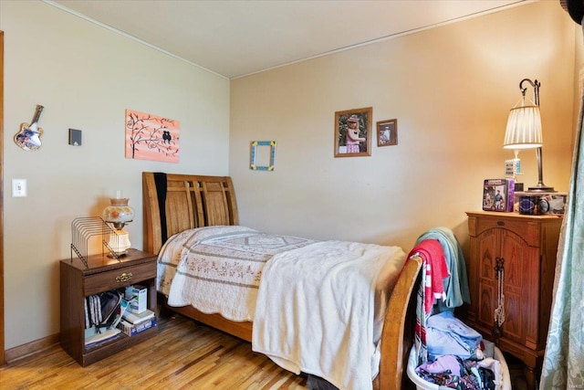 bedroom featuring hardwood / wood-style floors