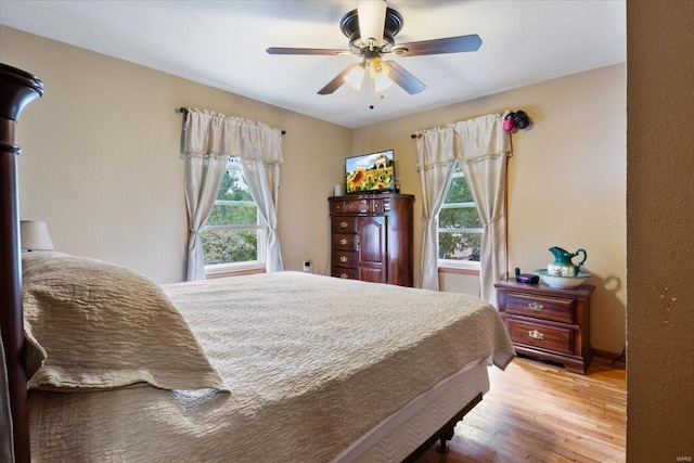 bedroom featuring ceiling fan and light wood-type flooring