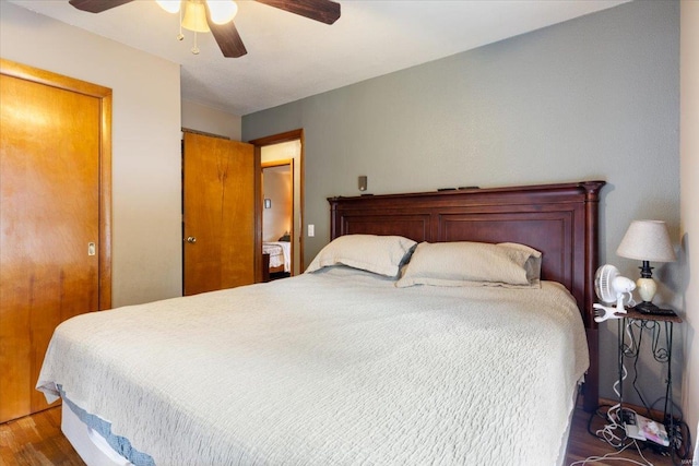 bedroom featuring ceiling fan and dark hardwood / wood-style flooring