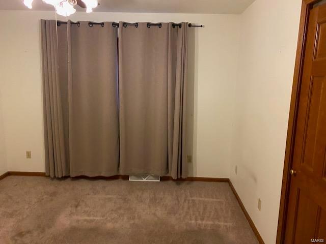 view of carpeted spare room