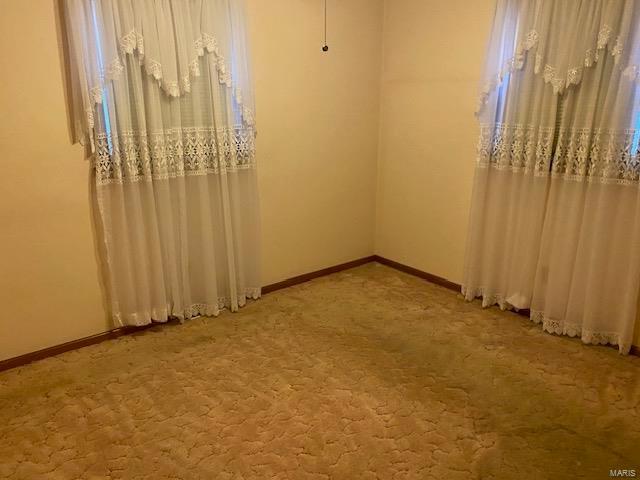 unfurnished room with carpet flooring