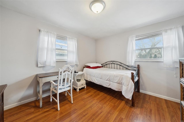 bedroom with hardwood / wood-style flooring