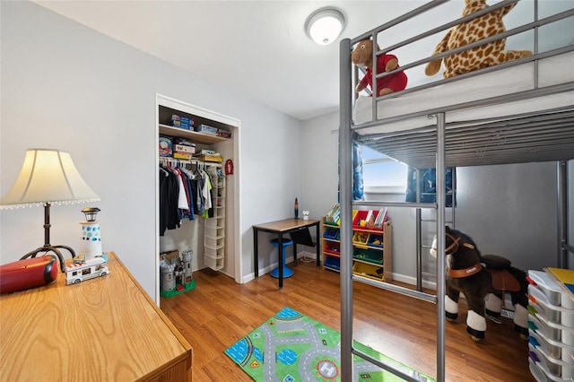 bedroom with a closet and wood-type flooring