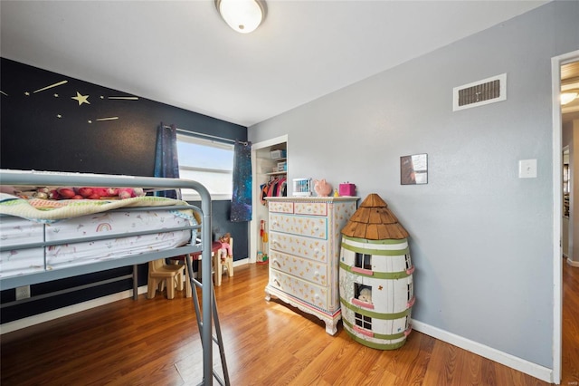 bedroom with wood-type flooring