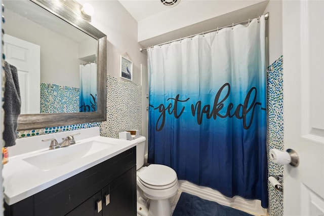 bathroom with vanity, a shower with curtain, and toilet