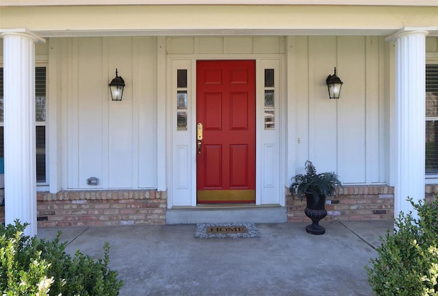 view of exterior entry featuring board and batten siding