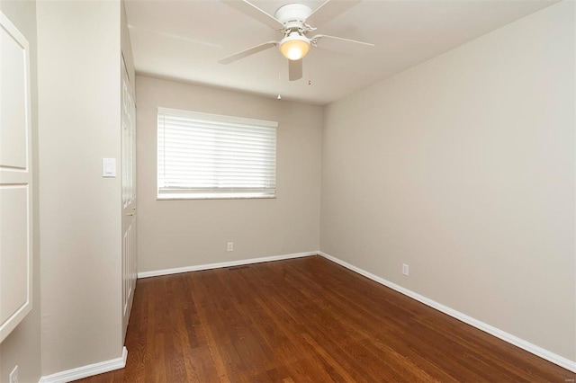 unfurnished room featuring ceiling fan, baseboards, and wood finished floors