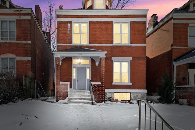 view of front of home with brick siding