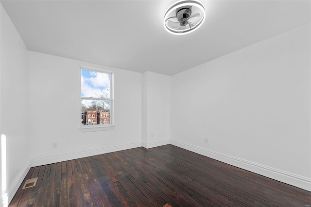 empty room with hardwood / wood-style floors