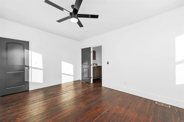 unfurnished room featuring dark hardwood / wood-style flooring and ceiling fan