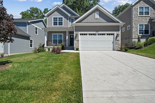 craftsman-style home featuring concrete driveway, covered porch, board and batten siding, a front yard, and a garage