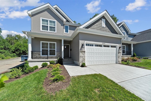 craftsman house featuring an attached garage, stone siding, a porch, and concrete driveway