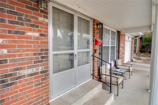 entrance to property with brick siding