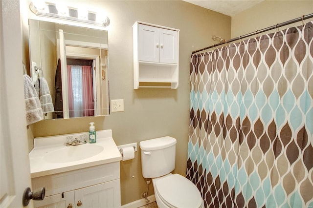 full bath featuring curtained shower, vanity, and toilet