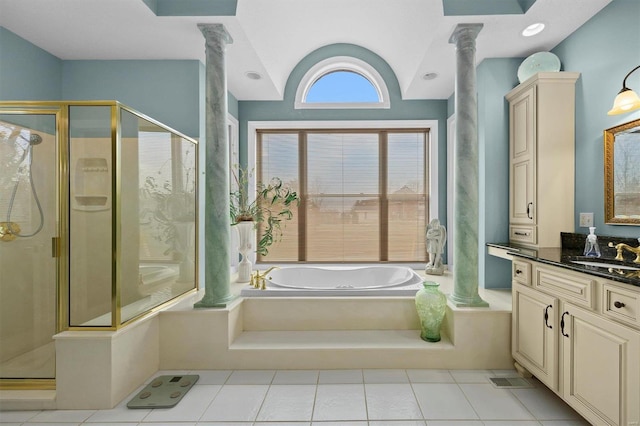 full bathroom with decorative columns, a stall shower, vanity, and a bath