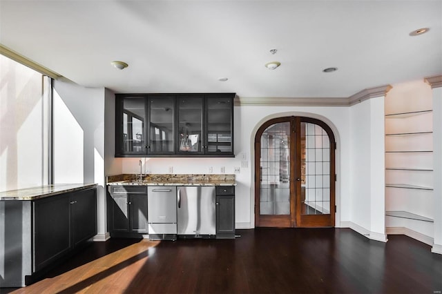 bar featuring baseboards, arched walkways, dark wood-style flooring, refrigerator, and french doors