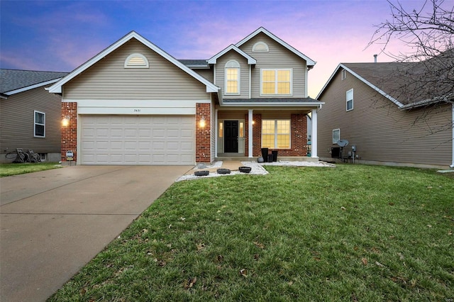 traditional home featuring driveway, a garage, a lawn, covered porch, and brick siding