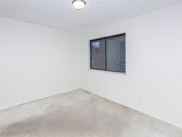 spare room featuring a textured ceiling