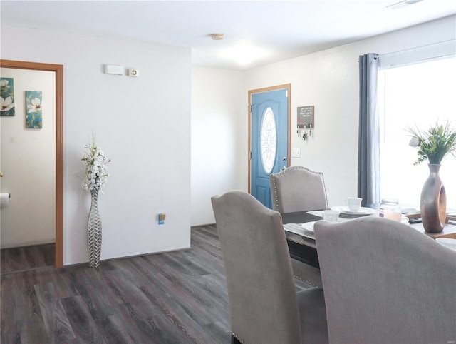 dining area with wood finished floors