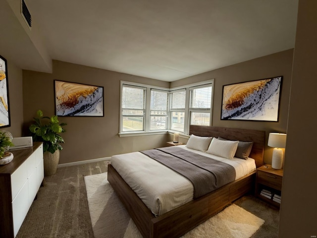 bedroom with visible vents, baseboards, and carpet floors