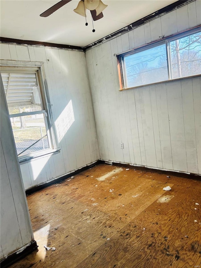 empty room featuring ceiling fan and wood-type flooring