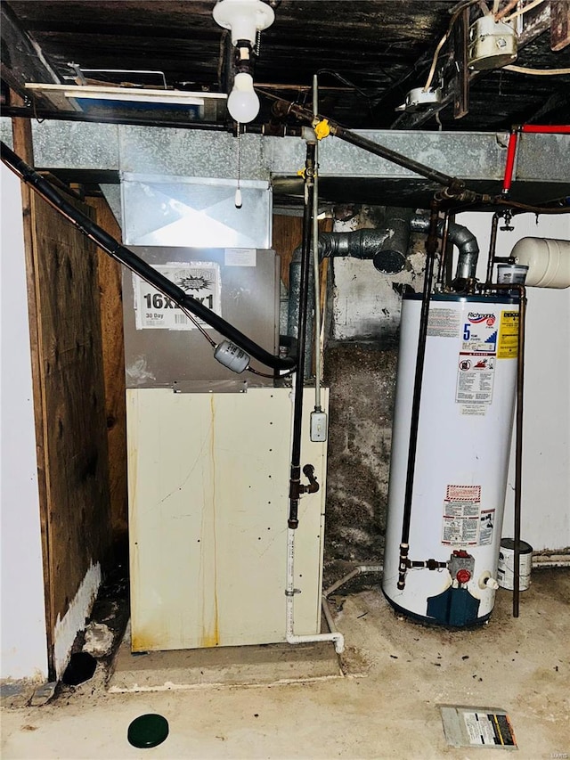 utility room featuring gas water heater