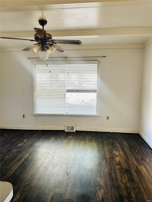 unfurnished room with visible vents, plenty of natural light, baseboards, and hardwood / wood-style flooring