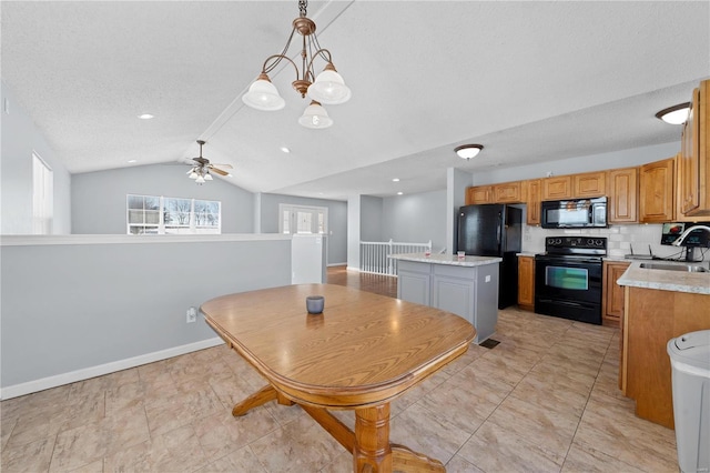 dining space with lofted ceiling, ceiling fan, a textured ceiling, and baseboards