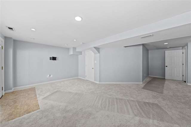 spare room with recessed lighting, visible vents, and light colored carpet