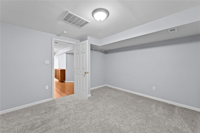 interior space with baseboards, a closet, visible vents, and light colored carpet