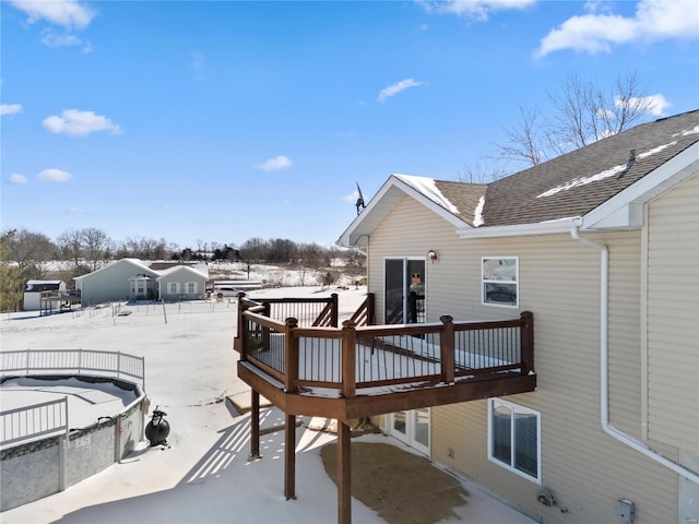 view of snow covered deck