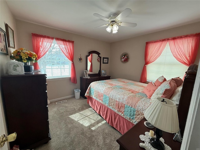 bedroom featuring a ceiling fan, carpet, visible vents, and baseboards