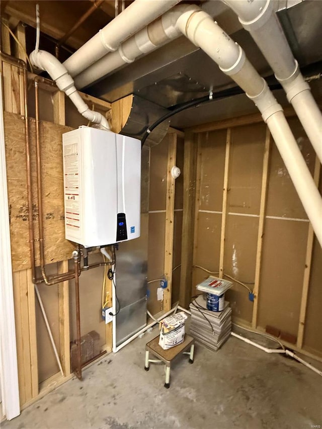 utility room with tankless water heater