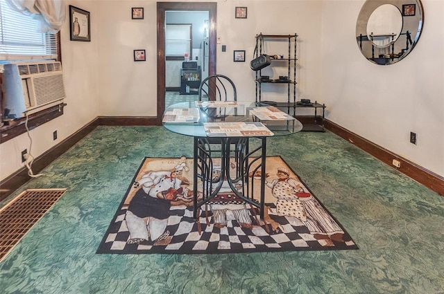 carpeted dining space featuring cooling unit and baseboards