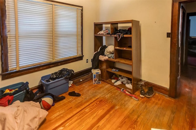 miscellaneous room with baseboards and wood finished floors