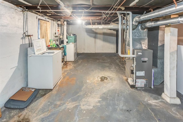 unfinished basement with washing machine and dryer