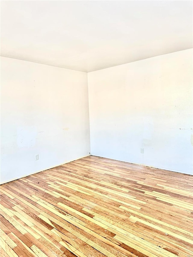 spare room with light wood-style floors