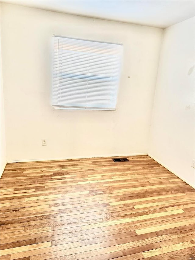 spare room with visible vents and light wood-style flooring