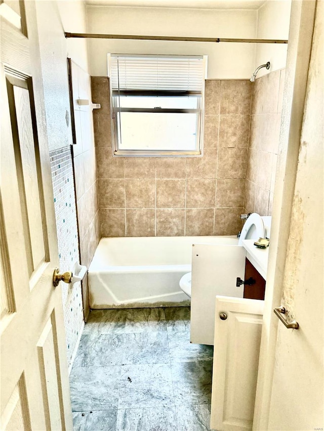 bathroom featuring shower / bathing tub combination, vanity, and toilet