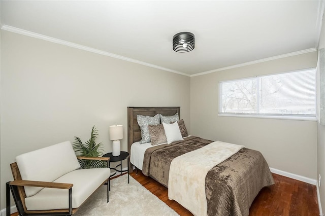 bedroom featuring dark wood-style floors, ornamental molding, and baseboards