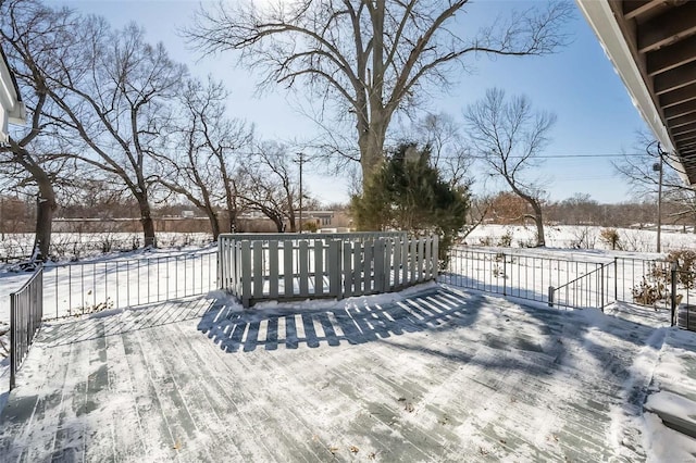 view of snow covered deck