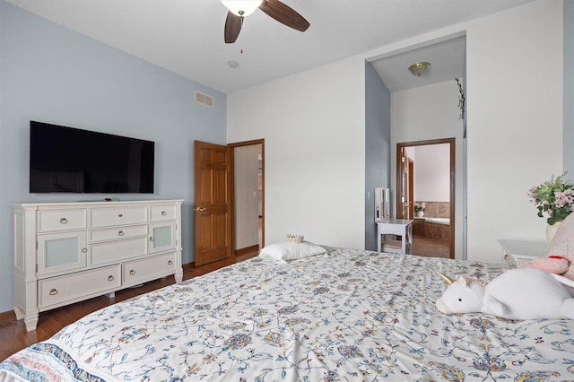 bedroom with visible vents, dark wood finished floors, a ceiling fan, and ensuite bathroom