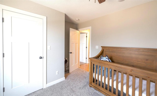 bedroom featuring carpet flooring and baseboards