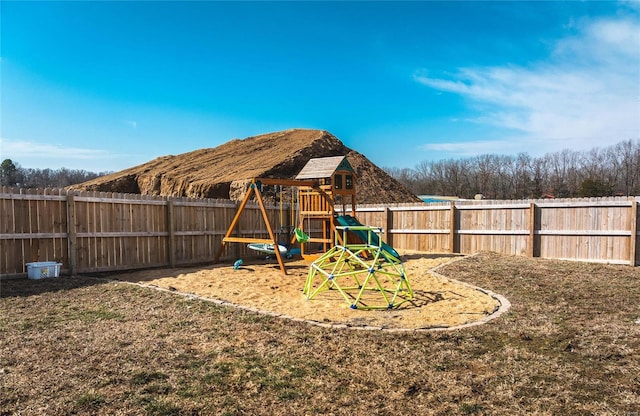 view of jungle gym with a fenced backyard