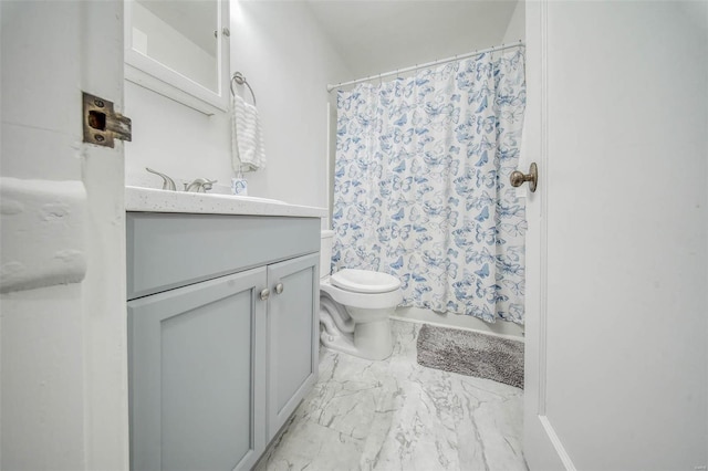 bathroom featuring toilet, marble finish floor, a shower with curtain, and vanity