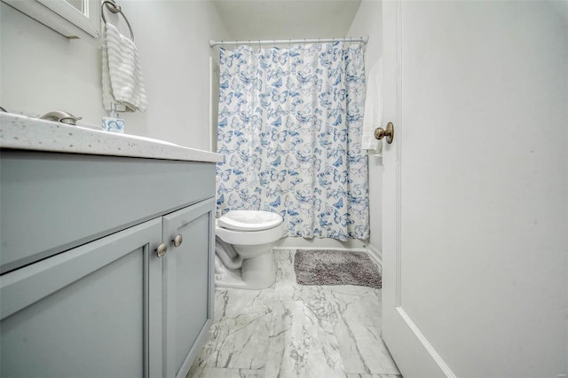 full bath with toilet, marble finish floor, and vanity