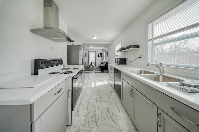 kitchen with electric range, a sink, exhaust hood, marble finish floor, and gray cabinets