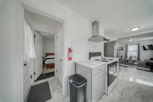 kitchen with white range with electric stovetop, marble finish floor, light countertops, open floor plan, and wall chimney exhaust hood